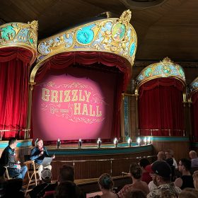 Steven Vagnini from the Walt Disney Archives and producer Ken Ricci talking to the crowd about the reimagined Country Bears Musical Jamboree in Grizzly Hall at Magic Kingdom Park.