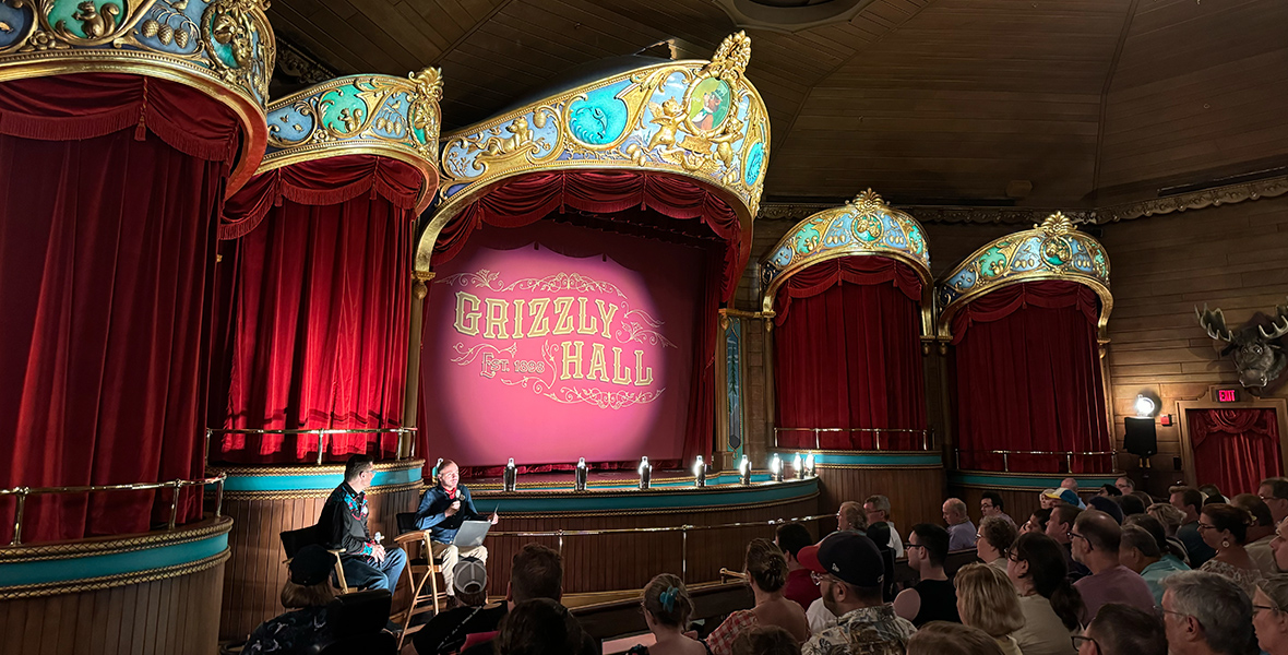 Steven Vagnini from the Walt Disney Archives and producer Ken Ricci talking to the crowd about the reimagined Country Bears Musical Jamboree in Grizzly Hall at Magic Kingdom Park.