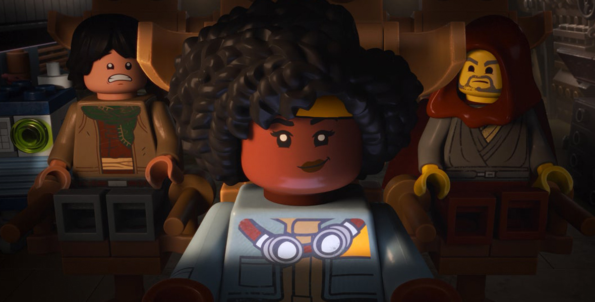 In a scene from LEGO Star Wars: Rebuild the Galaxy (L-R), Sig Greebling (voiced by Gaten Matarazzo), Yesi Scala (voiced by Marsai Martin), and Jedi Bob (voiced by Bobby Moynihan) sit on chairs inside a starship. Sig appears frightened; Yesi is determined; and Jedi Bob looks vexed.