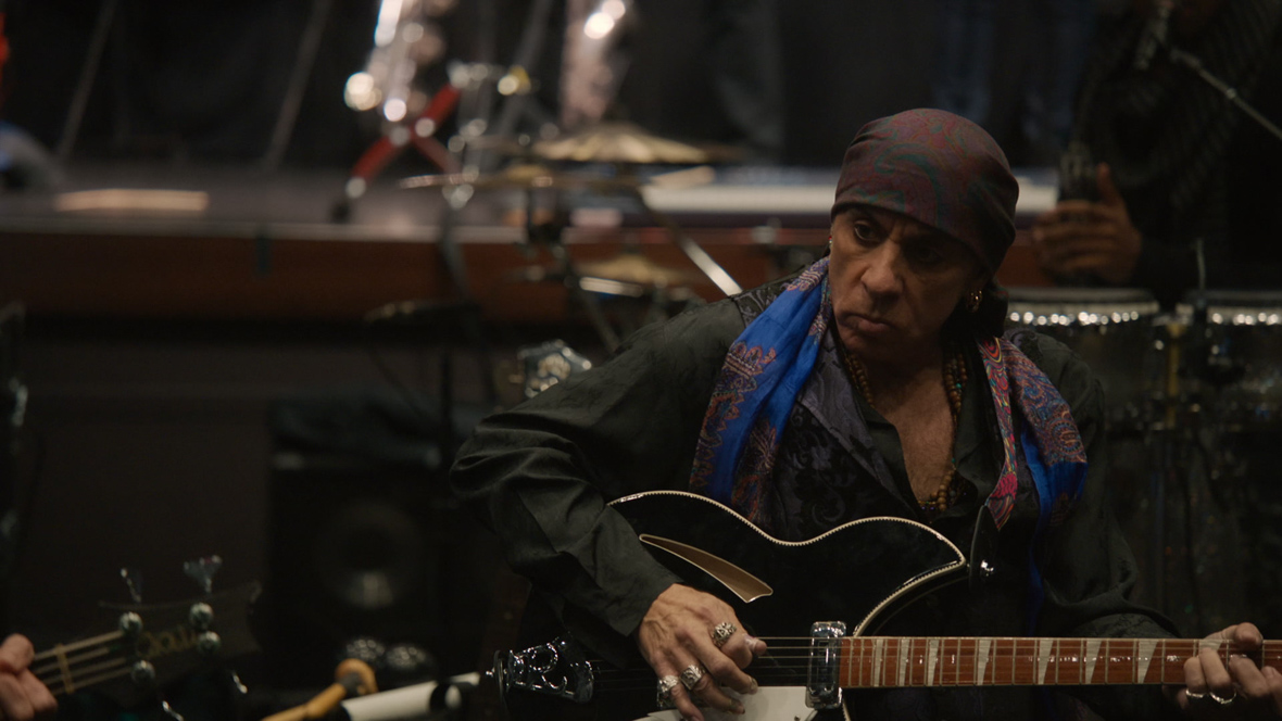 The E Street Band guitarist Steven Van Zandt strums his instrument.