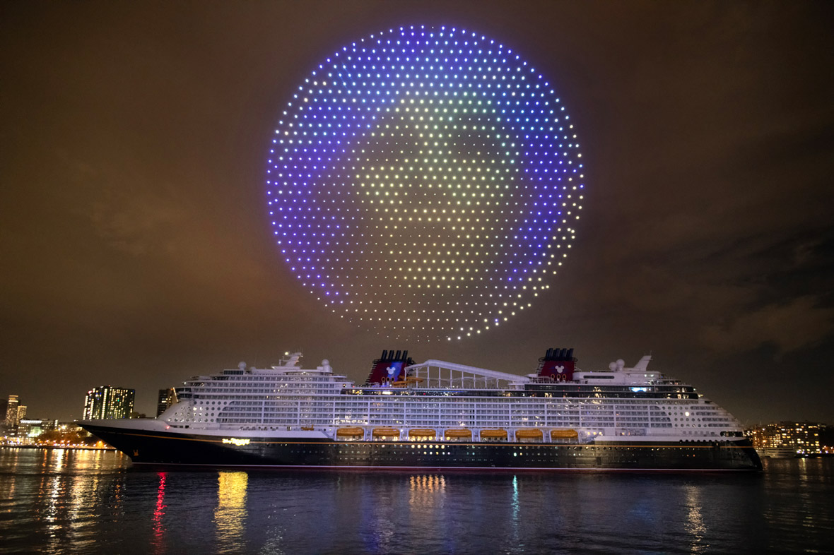 Drones form Madame Leota above the Disney Treasure cruise ship.