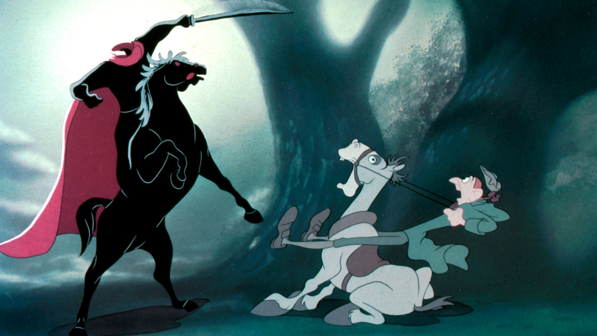 In a scene from The Adventures of Ichabod and Mr. Toad, the Headless Horseman, wearing flowing crimson cape, raises his sword high while riding a powerful black horse rearing on its hind legs. Ichabod Crane (voiced by Bing Crosby), looking terrified, pulls on the reins of his panicked, wide-eyed white horse. The background features an eerie forest background with fog.