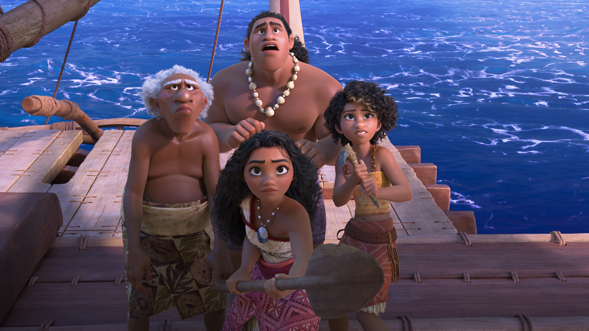 Moni (voiced by Hualalai Chung), Loto (voiced by Rose Matafeo), and Moana (voiced by Auli‘i Cravalho) stand as a group on their boat, looking up with trepidation at an offscreen enemy. Moana is holding out her oar defensively.