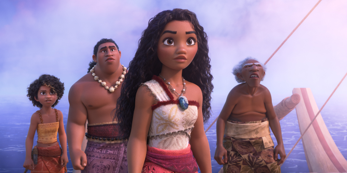 In an image from Walt Disney Animation Studios’ Moana 2, Loto (voiced by Rose Matafeo), Moni (voiced by Hualalai Chung), Moana (voiced by Auli‘i Cravalho), and Kele (voiced by David Fane) stand on their ship, looking out at something off screen. Behind them is the ocean, disappearing into a cloudy fog.