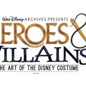 The logo for the Walt Disney Archives Presents Heroes & Villains: The Art of the Disney Costume exhibit, featuring the worlds “Heroes & Villains” in large, stylized text. The “&” symbol is stylized as a needle and thread.