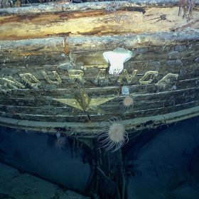 In an image from National Geographic’s Endurance, the stern of the Endurance is seen underwater, with the name and emblematic polestar at center.