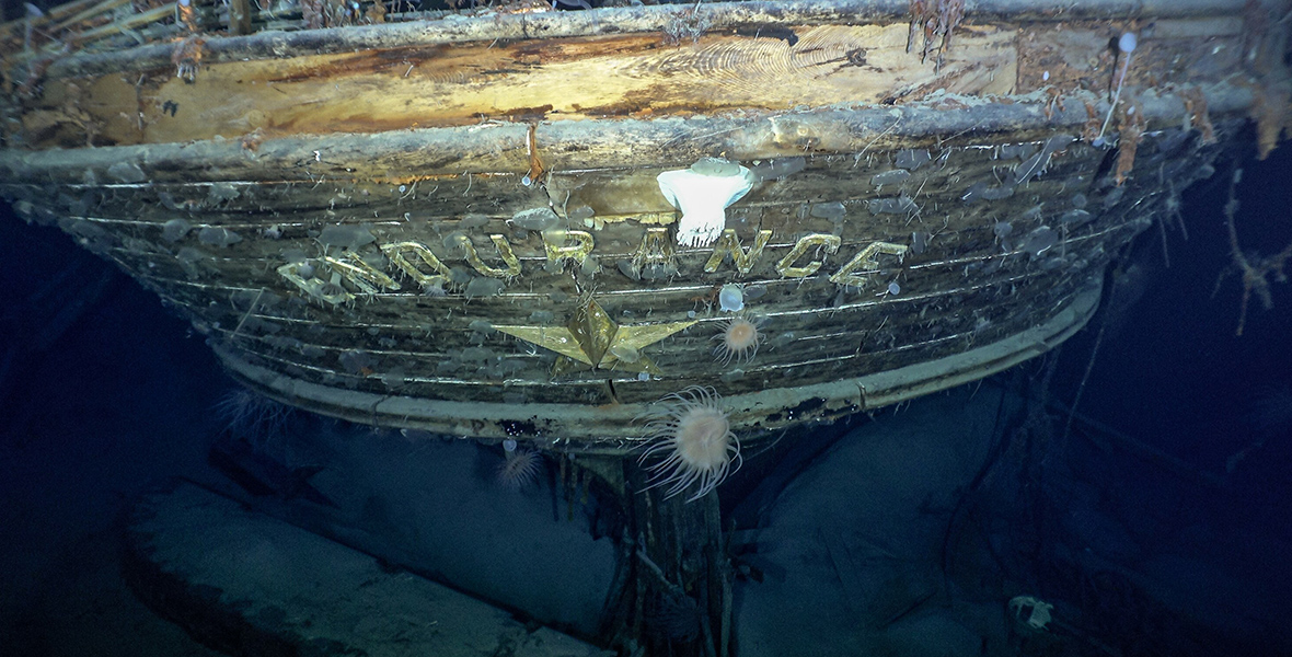 In an image from National Geographic’s Endurance, the stern of the Endurance is seen underwater, with the name and emblematic polestar at center.