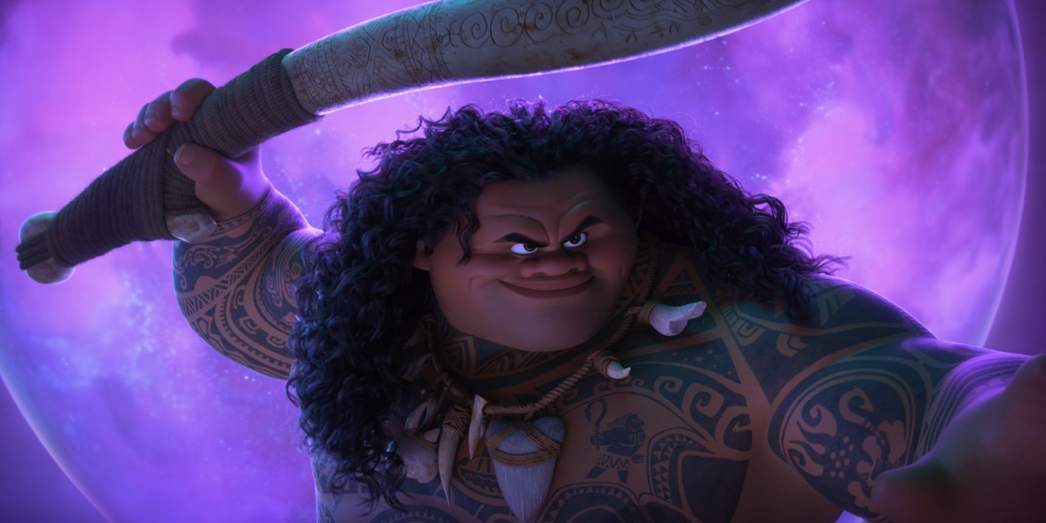In an image from Moana 2, Maui (voiced by Dwayne Johnson) is holding up his hook and looking at something off camera to the right.