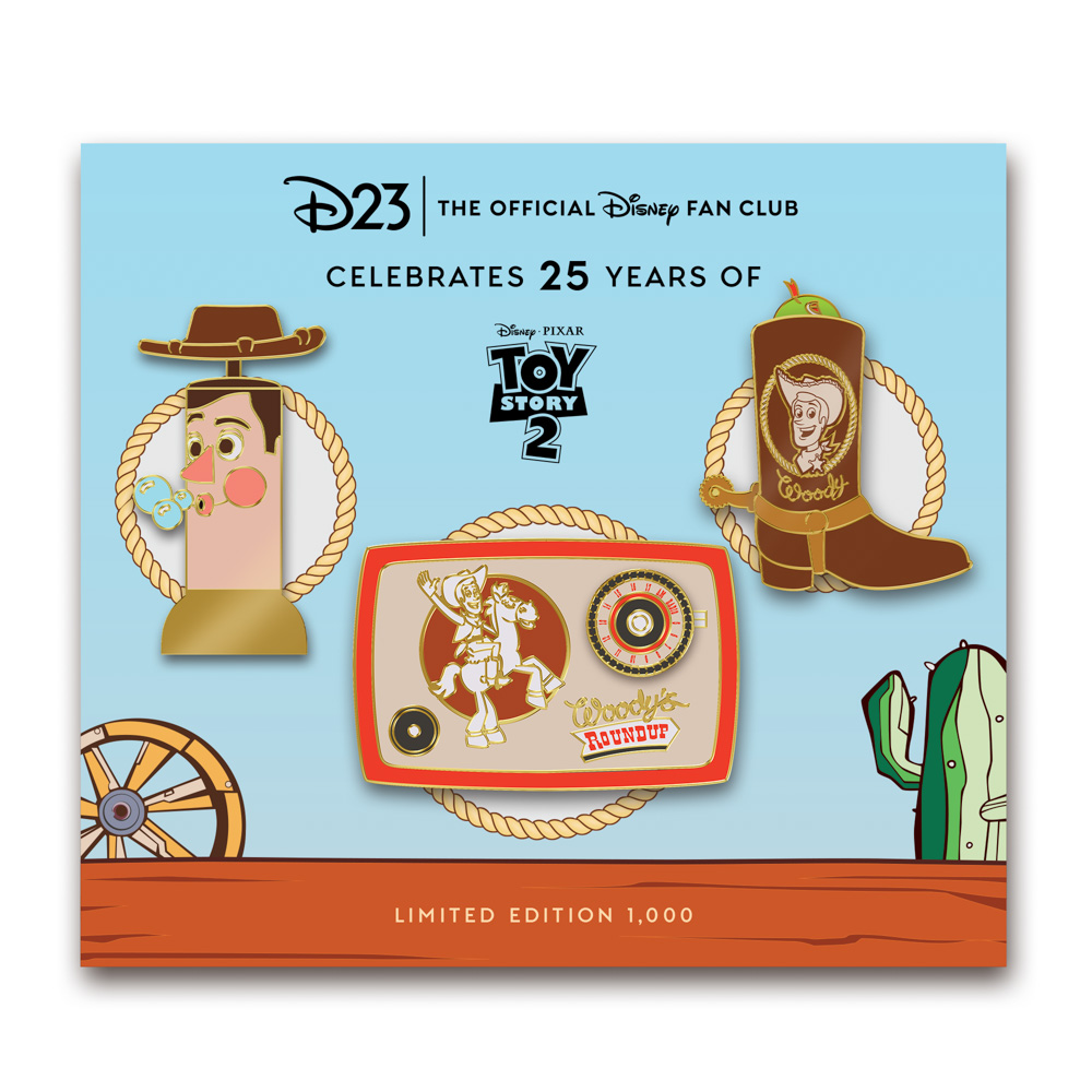 An image of the D23-exclusive Toy Story 2 25th Anniversary Woody’s Roundup Pin Set, which features three Toy Story 2-themed pins. The first pin depicts a Woody bubble blower; the second pin captures the essence of “Woody’s Roundup” with a vintage radio; and the third pin features a classic Woody boot with a snake peeking out. The pins are located on a backer card inspired by “Woody’s Roundup” and featuring the D23 logo alongside a celebration of 25 years.