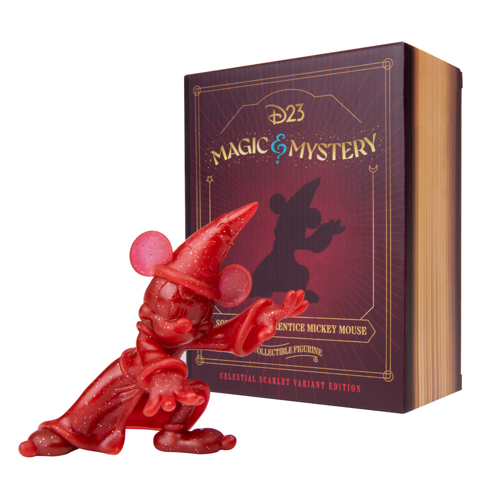 An image of the Sorcerer Apprentice Mickey Mouse Collectible Figurine as the Scarlet Glitter Variant posing in front of the box it comes in, which emulates a magic book. The box is dark purple with gold, blue, and red accents featuring a silhouette of the Sorcerer Mickey Mouse Collectible Figurine. Towards the top of the box, it says “D23 Magic & Mystery”; underneath the silhouette it says “Sorcerer Apprentice Mickey Mouse Collectible Figurine,” and towards the bottom of the box it says “Celestial Scarlet Variant Edition.”