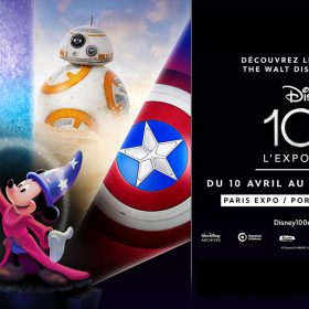 A graphic promoting the Disney100 exhibition in Paris, France. On the left is a collage of several Disney characters and iconic images—(left to right) Cinderella’s glass slipper; Elsa from Frozen; BB8 from Star Wars; and Captain America’s shield. They surround an image, at center, of Sorcerer Mickey, who has a stream of stars going from one outstretched hand to the other. On the right is the Disney100 logo surrounded by French text—all white text against a black background—promoting the exhibition as running from April 10 through October 5 at the Paris Expo Porte de Versailles.