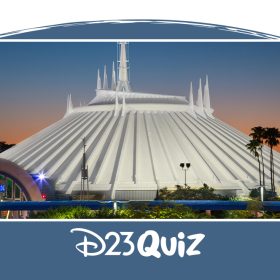 An image of Disneyland’s Space Mountain attraction illuminated during sunset, showcasing its iconic futuristic architecture with sharp spires and a sleek white dome. The structure stands against a vibrant orange and blue sky, surrounded by lush greenery.