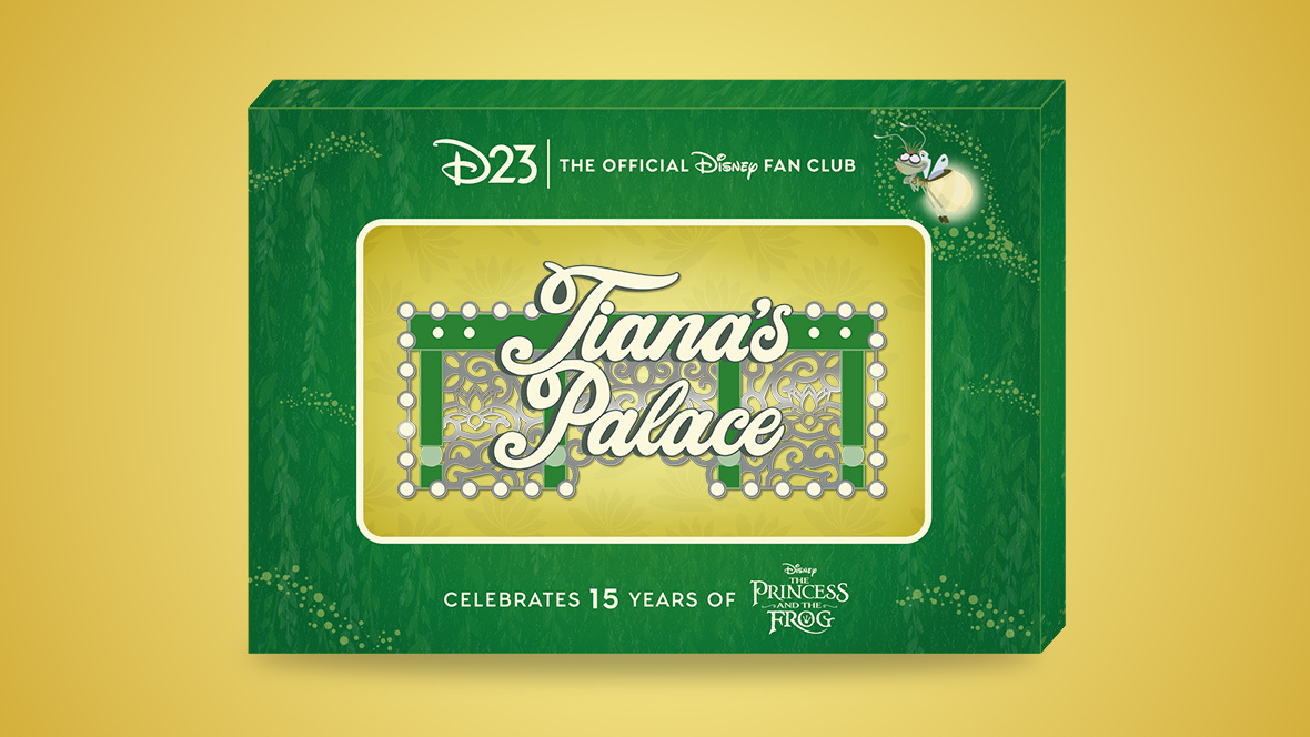 A limited-edition D23 exclusive pin celebrating the 15th anniversary of Disney's The Princess and the Frog. The pin features an ornate design with the words 'Tiana’s Palace' in elegant script, surrounded by decorative elements reminiscent of New Orleans architecture, including green, gold, and white accents. The pin is displayed in a green collector’s box with gold detailing, featuring the D23 logo, a firefly illustration of Ray, and the text 'Celebrates 15 Years of The Princess and the Frog' at the bottom.