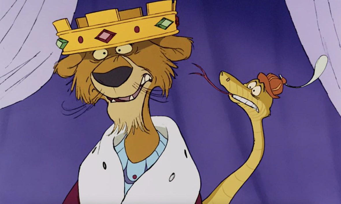 King Richard from “Robin Hood” wearing a crown and looking confused. Sir Hiss is on his left side, sticking his tongue out and looking concerned.  