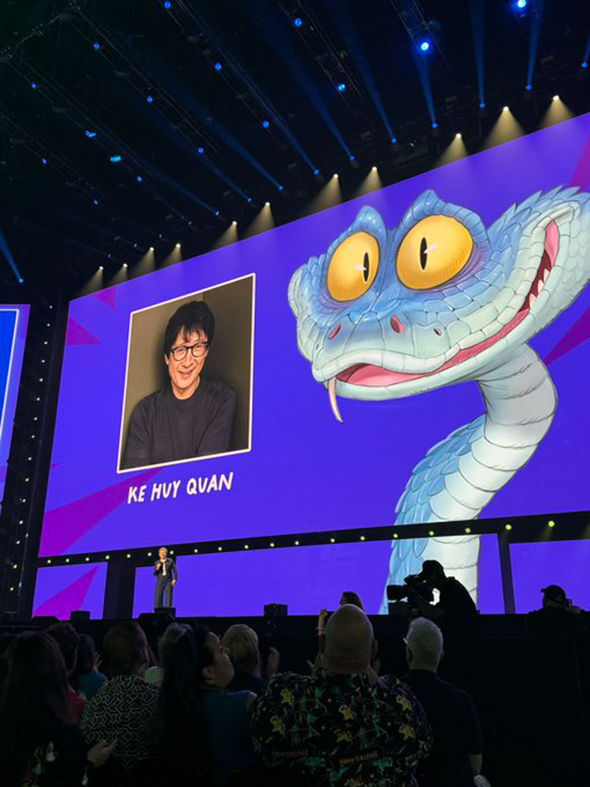 Gary, a new snake character from Zootopia 2, featured on-screen alongside voice actor Ke Huy Quan at D23 in 2024 