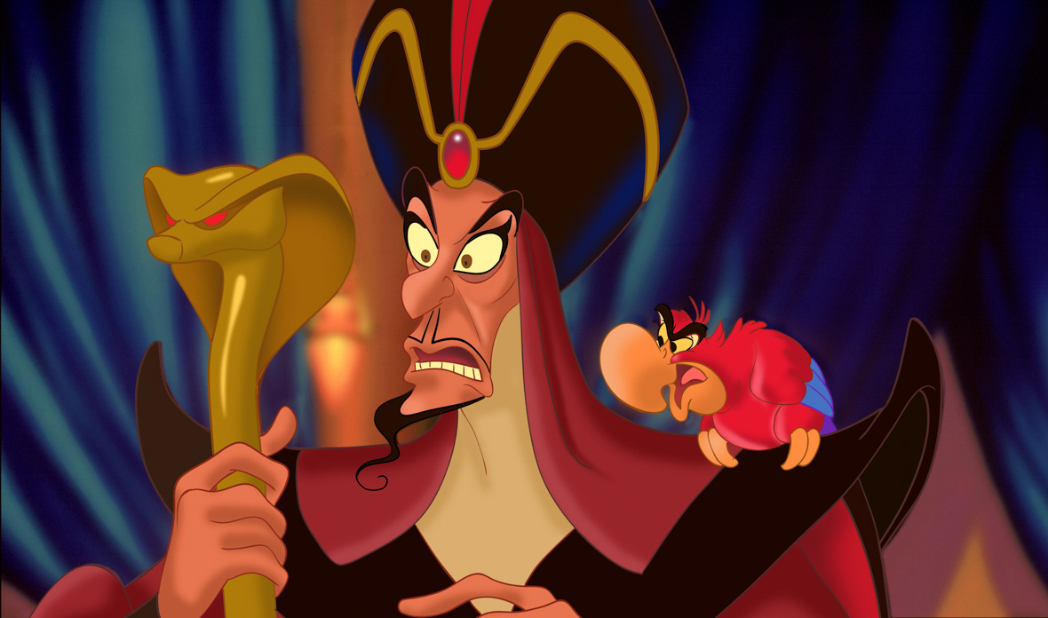 Jafar from Aladdin holding a serpent staff and looking serious while Iago sits on his left shoulder, also looking serious.