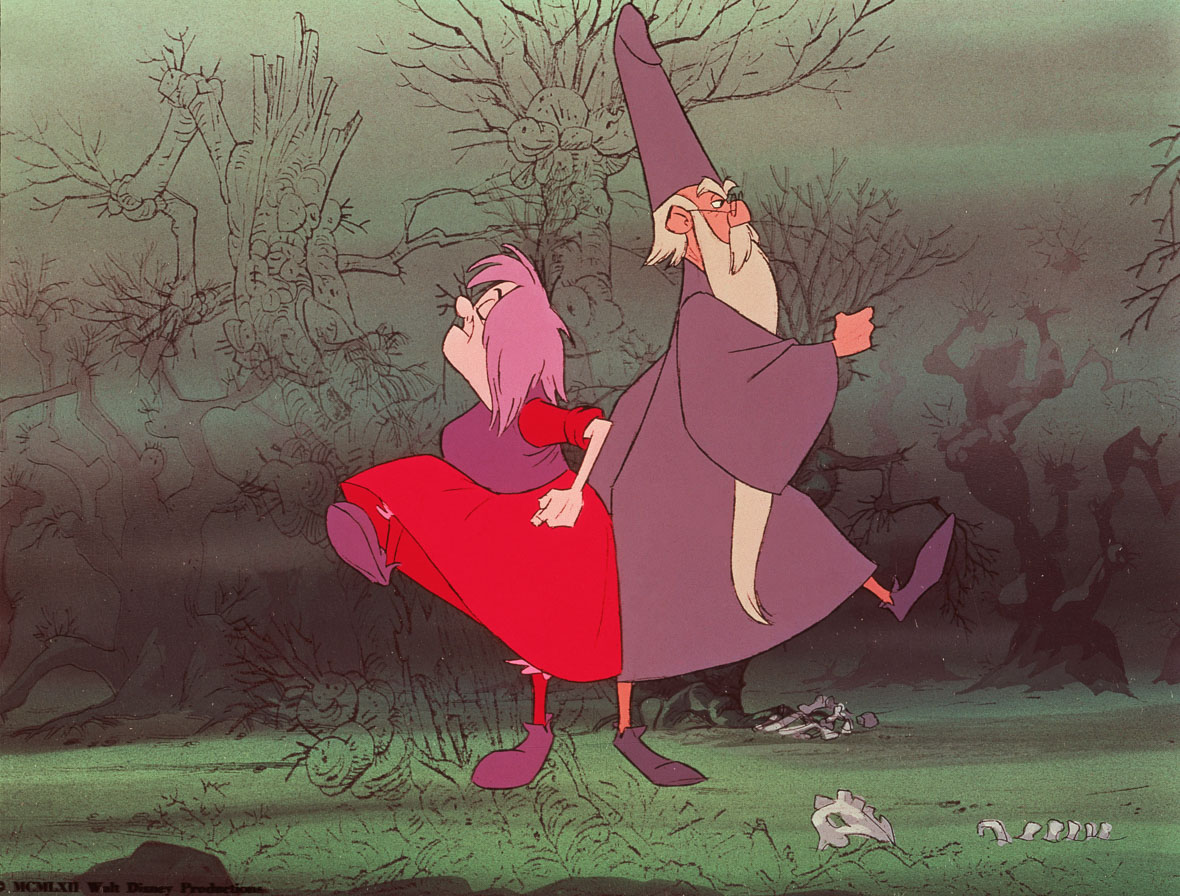 Madam Mim and Merlin from The Sword in the Stone standing back-to-back and walking away from each other.  