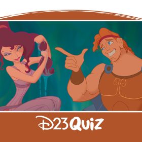 Hercules awkwardly smiles and points at Megara while she sits on a ledge and looks at him.