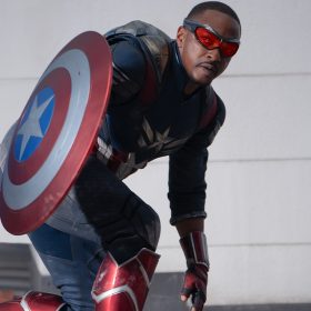 Captain America (Anthony Mackie) crouches and holds his vibranium shield in Captain America: Brave New World.