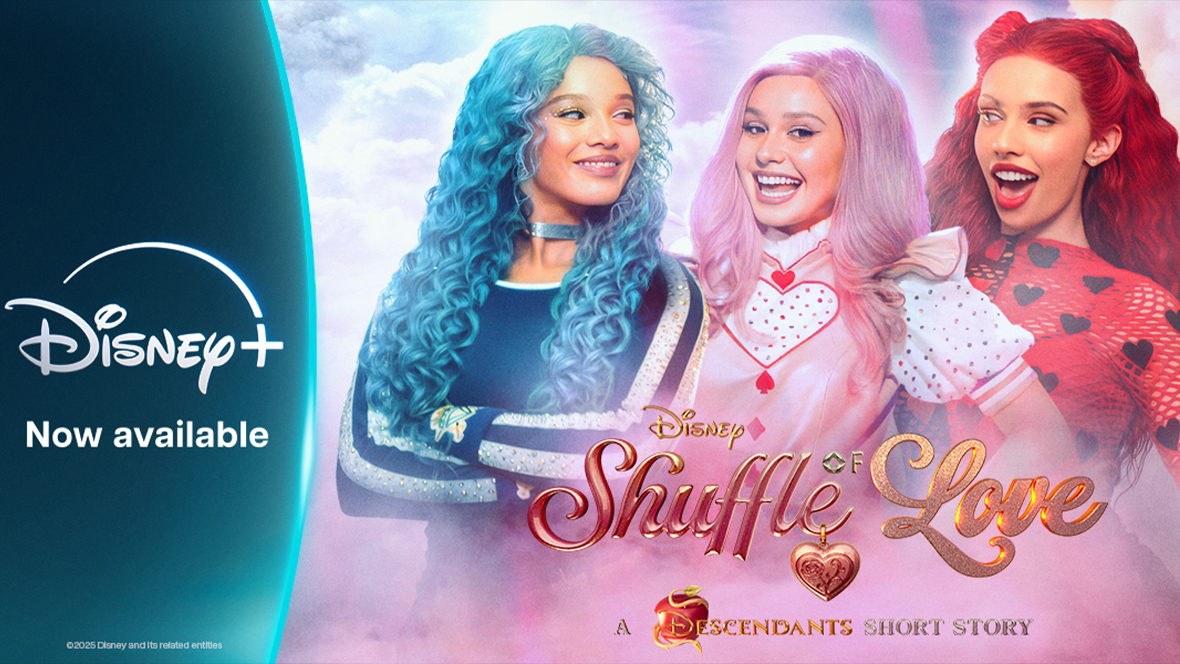 Disney+ graphic featuring three characters from Descendants all looking at each other. Chloe has blue hair and is wearing a blue long-sleeve shirt, Bridget has pink hair and is wearing a pink dress with a white and red short-sleeve shirt underneath, and Red has red hair and is wearing a red long-sleeve shirt with back hearts. Underneath the three characters reads “Shuffle of Love: A Descendants Short Story.”