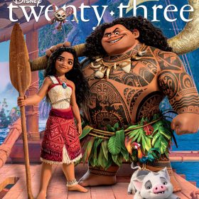 Characters from the film Moana 2, including Moana and Maui, stand on their ocean-going canoe at sea in this front cover image from the Winter issue of Disney twenty-three. A tropical island appears in the distance behind them.