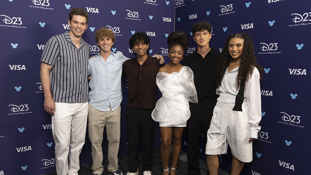 Daniel Diemer, Walker Scobell, Aryan Simhadri, Leah Sava Jeffries, Charlie Bushnell, and Dior Goodjohn take a group photo at D23: The Ultimate Disney Fan Event.