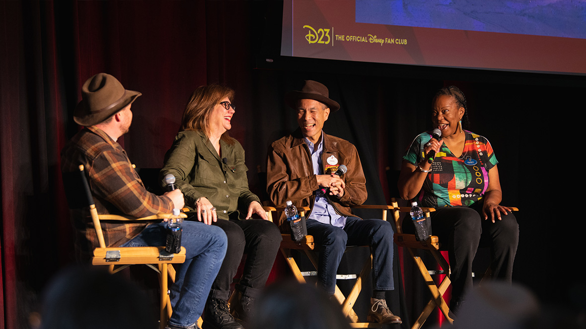 ICYMI: D23 Event Lookback Jan-Mar 2025 D23’s Justin Arthur, and Walt Disney Imagineers Susan Bonds, Daniel Jue, and Charita Carter share a laugh. Arthur and Jue are wearing brown fedoras reminiscent of Indiana Jones.