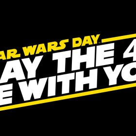 White and yellow logo reading “Star Wars Day, May the 4th Be With You” on a black background.