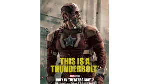 Alexei Shostakov (Red Guardian) in his red Super Hero outfit, with yellow text that reads “This is a Thunderbolt*”