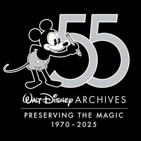 The logo for the Walt Disney Archives 55th anniversary, set on a black background, features a 1920s-era, black-and-white-style Mickey Mouse in gray shorts holding a pencil next to a large number “55” set in gray. Below these icons is a logo reading “Walt Disney Archives” in white. Below it is a white line separating the slogan “Preserving the Magic,” with “1970–2025” on the bottom line.