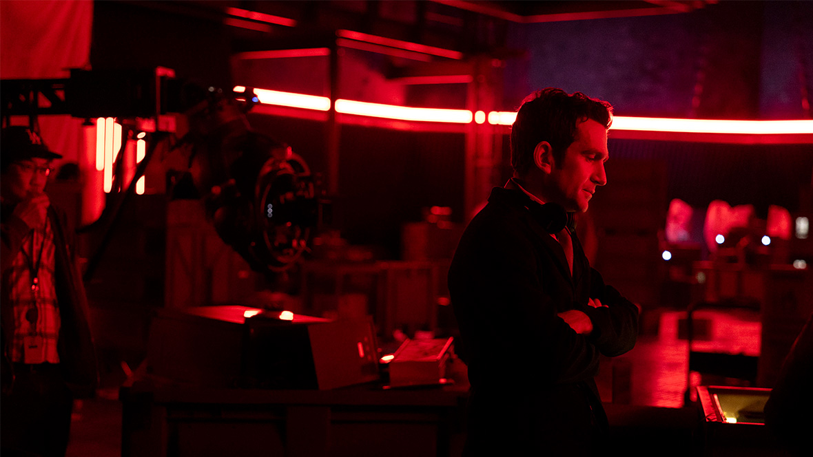 Director Jake Schreier looks at a monitor on the set of Marvel Studios' Thunderbolts*.