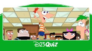 In a photo from season 5 of Phineas and Ferb, Phineas is standing on a desk and pointing, surrounded by Ferb, Isabella, Baljeet, Buford, and other students in a classroom.