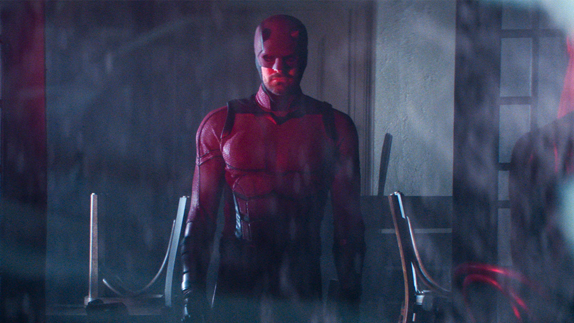 Daredevil in Daredevil: Born Again, pictured in his vigilante suit through the rain at night.