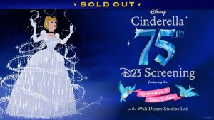A promotional image for D23’s Cinderella 75th Celebration Screening featuring the Restoration & Film Archive event. At left is a film still of Cinderella’s dress transformation scene from 1950 animated classic. With her arms raised, Cinderella has an awestruck and wondrous expression as a flurry of sparkles surround a beautiful silver gown. To the right of the image is raised white stylized text reading “Cinderella 75th D23 Screening featuring the Restoration & Film Archive at the Walt Disney Studios Lot.” The “75th” takes on the texture of a multifaceted blue crystal, while two bluebirds from the film hold a pink ribbon with “Restoration & Film Archive” written out in curved white text. A banner at the top reads SOLD OUT.