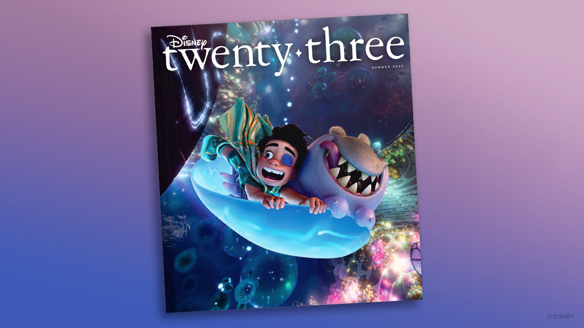 This is the cover of the Disney twenty-three magazine, Summer 2025 edition, featuring vibrant and whimsical artwork from the Pixar film Elio. The cover showcases Elio, an energetic boy with a bandaged eye, and his alien companion riding a bubble-like creature through a glowing, otherworldly space filled with swirling colors and luminous shapes.