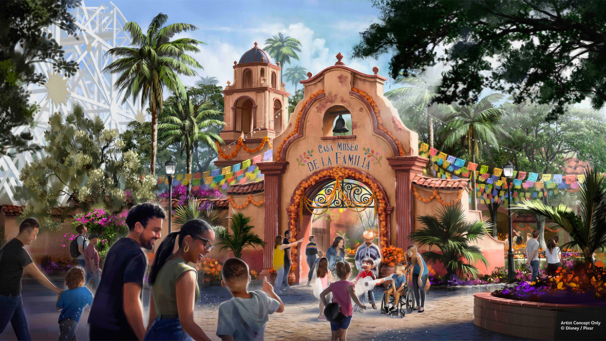 Artist rendering of the new Coco attraction coming to Disney California Adventure. Rendering features a reddish-brown mission-style archway with a small bell and “Casa Museo de la Familia” painted on the front. The archway is decorated with marigold flowers and colorful papel picado. Families are seen walking through the archway and talking with Miguel, the main character of the film Coco.