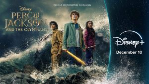 Aryan Simhadri, Walker Scobell, and Leah Sava Jeffries appear in key art for Percy Jackson and the Olympians Season 2 as their respective characters, Grover Underwood, Percy Jackson, and Annabeth Chase. The Disney+ logo and premiere date are on the right.