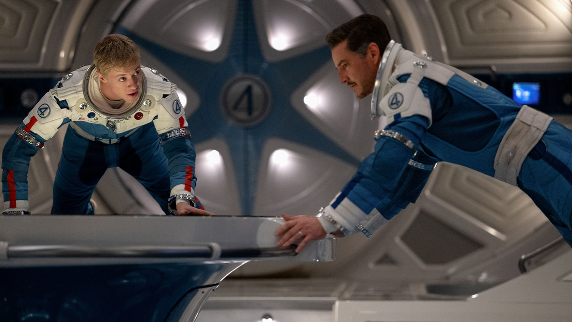 Johnny Storm/Human Torch (Joseph Quinn) and Reed Richards/Mister Fantastic (Pedro Pascal) float in a spaceship in a scene from Marvel Studios' The Fantastic Four: First Steps.