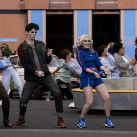Cast members from ZOMBIES 4: Dawn of the Vampires perform an energetic outdoor dance sequence.