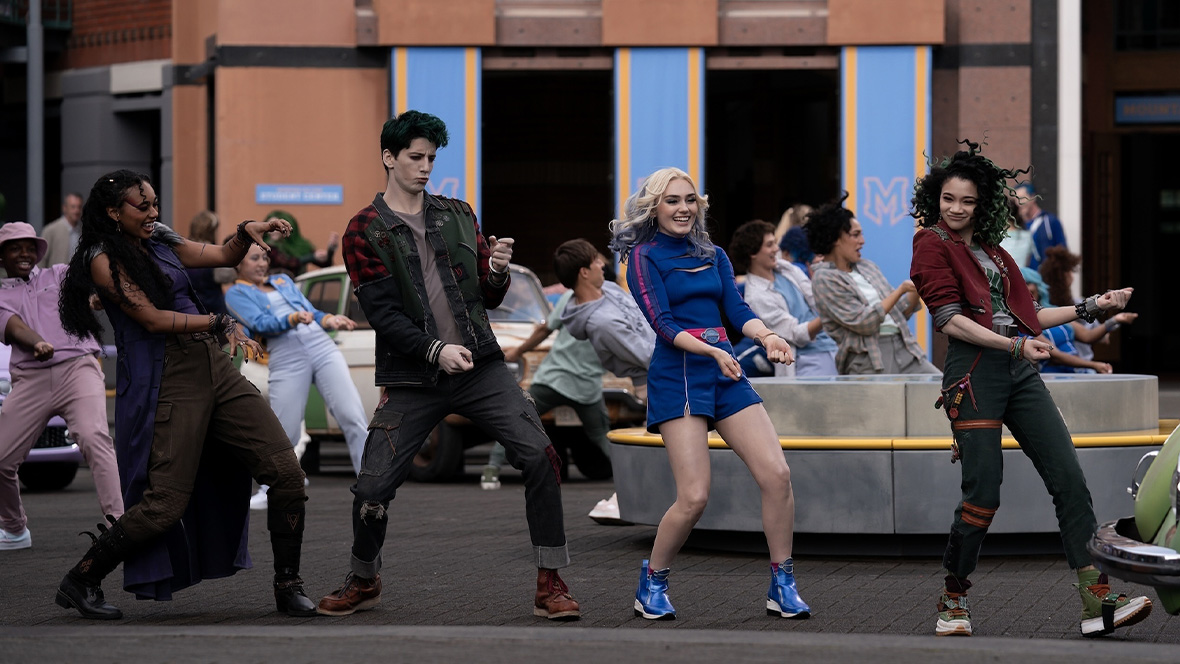 Cast members from ZOMBIES 4: Dawn of the Vampires perform an energetic outdoor dance sequence.