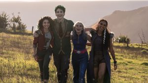 Zombie Eliza (Kylee Russell), zombie Zed (Milo Manheim), alien Addison (Meg Donnelly), and werewolf Willa (Chandler Kinney) embrace atop Mount Rayburn in the Disney Channel Original Movie ZOMBIES 4: Dawn of the Vampires.