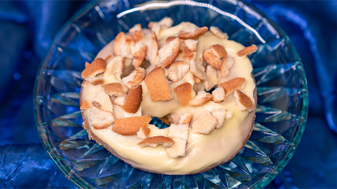 Cream-cheese filled pretzel dipped in lemon-flavored icing and topped with crushed vanilla wafers, available near Star Tours – The Adventures Continue at Disneyland Park.