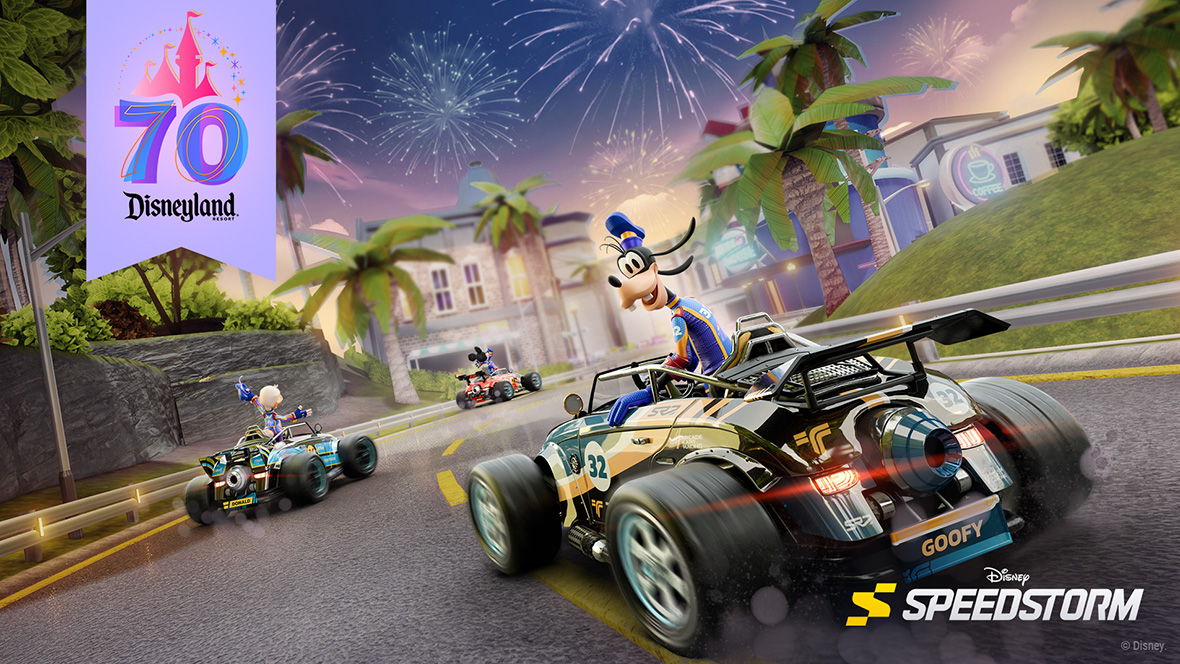 In an image from Disney Speedstorm, Goofy is wearing the Disneyland 70th Celebration racing suit in a kart racing on a road with Donald Duck and Mickey Mouse in front of him with their own Disneyland 70th Celebration racing suits. The Disneyland 70th logo is in the top left corner with the pink castle outline and number 70 that is blue and purple. There are green palm trees and buildings in the background with fireworks in the sky.