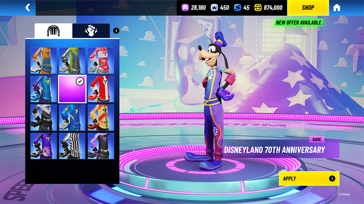 In an image from Disney Speedstorm, Goofy is wearing the Disneyland 70th Celebration racing suit and is standing on a platform, with different racing suits in various colors in a selection panel to the left. The background is blue and purple with different game elements and numbers.