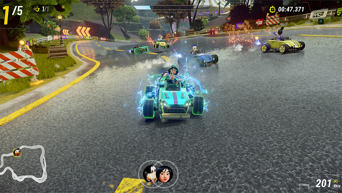 In an image from Disney Speedstorm, Jasmine from Aladdin is in front, racing in a blue kart, and Donald Duck and Mickey Mouse are behind. They are all racing on a grey road with trees and forest in the background.