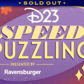 A promotional image for D23’s Speed Puzzling event presented by Ravensburger. The main text is set on a purple disc and in stylized yellow text— “speed” is bold and italicized. D23 and Ravensburger appear in white text. The main background of the image is an array of soft oranges and purples, with outlines of puzzle pieces and geometric shapes. Several orange puzzles appear around the text. A banner at the top reads SOLD OUT.