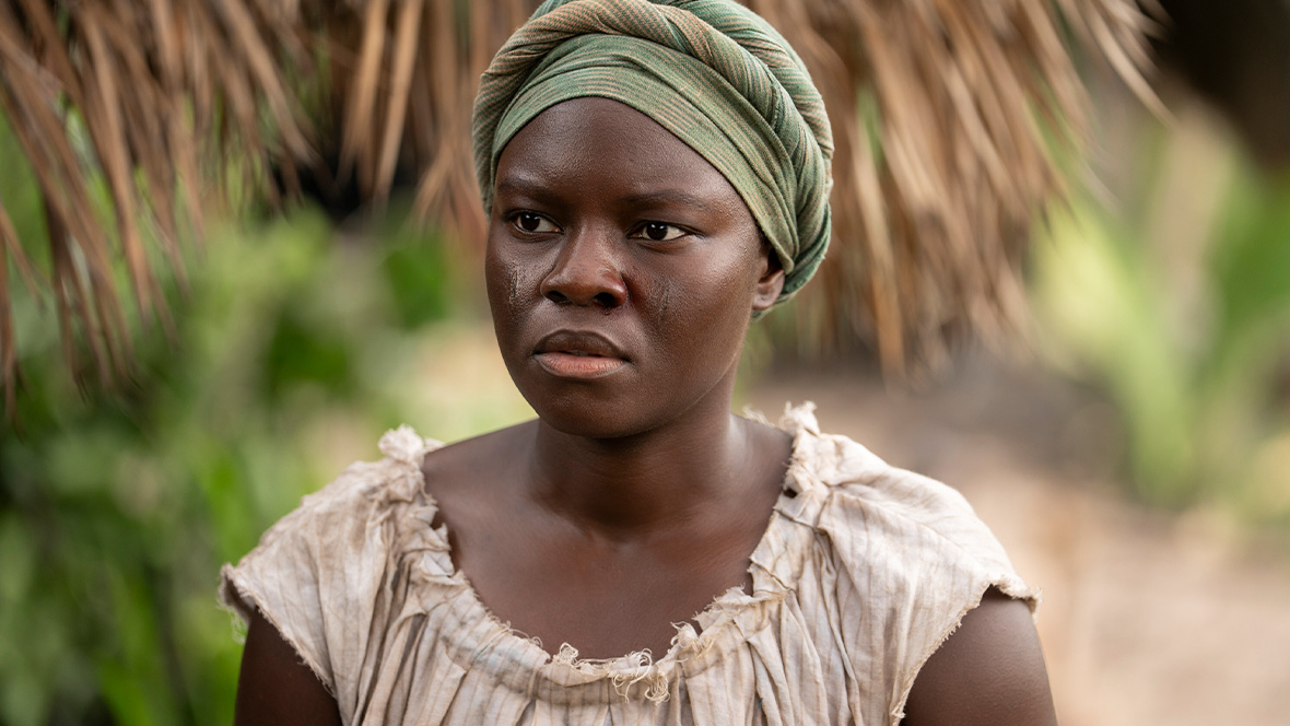 Shaunette Renee Wilson, as Big Kit, is pictured in a close-up shot, staring to the left at something off camera.