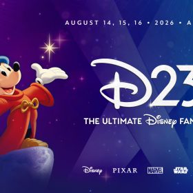 A promotional image for D23: The Ultimate Disney Fan Event, taking place on August 14, 15, and 16, 2026, in Anaheim, California. Sorcerer Mickey—in a red robe and a pointed blue hat with stars and moons—smiles and stands prominently on the left side of the image with his arms raised, looking at the viewer. The event logo is spotlighted on the right side of the image; in the background are visuals resembling searchlights and the outline of a castle. Toward the bottom of the image are the logos for Disney, Pixar, Marvel, Star Wars, and National Geographic. The image is dominated by jewel tones of purple and blue, evoking a sense of magic and sophistication.