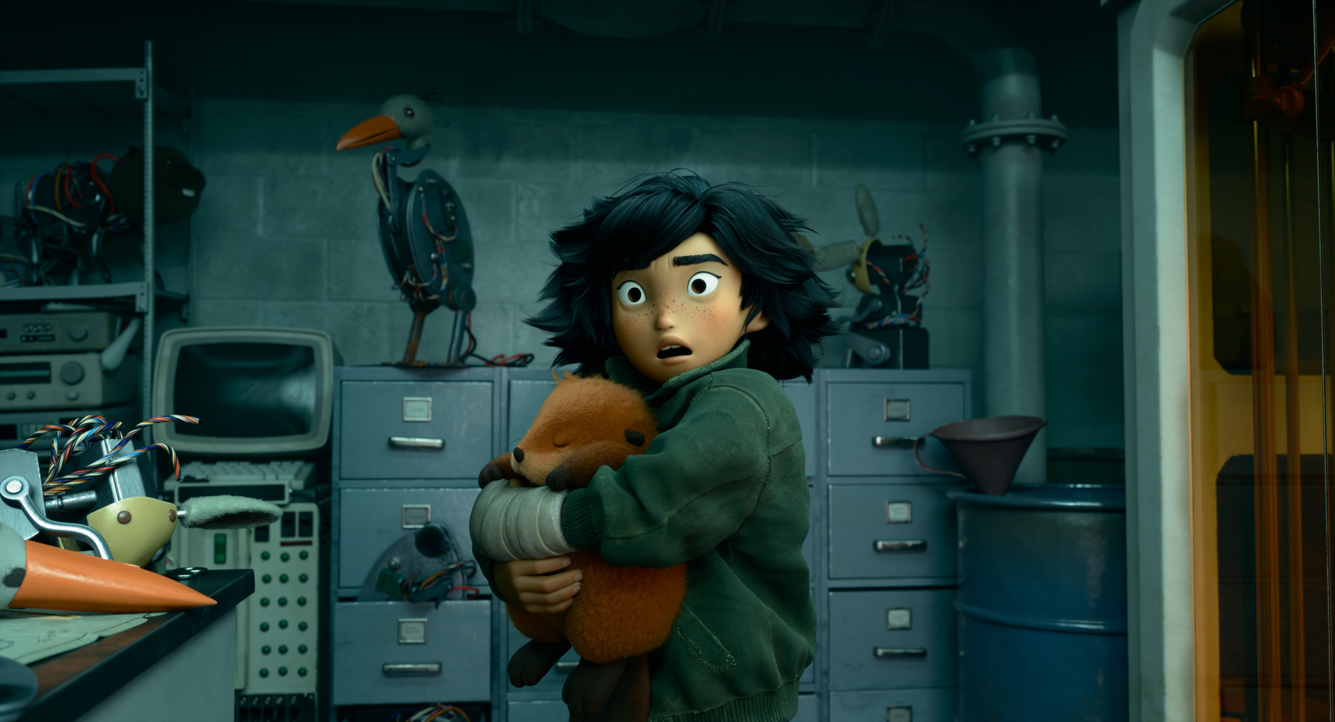 This is a scene from the upcoming Disney and Pixar animated feature Hoppers. In what appears to be the basement of a scientific research facility, with an old metal barrel, decrepit file metal file cabinets, and old electronic equipment on a desktop and on shelves against a concrete block wall, a girl stands, holding what appears to be a sleeping beaver. The girl has a shocked or frightened expression on her face and has thick black hair that swoops into many peaks. She has dark eyes and freckles and wears a green jacket. Her left hand is bandaged.