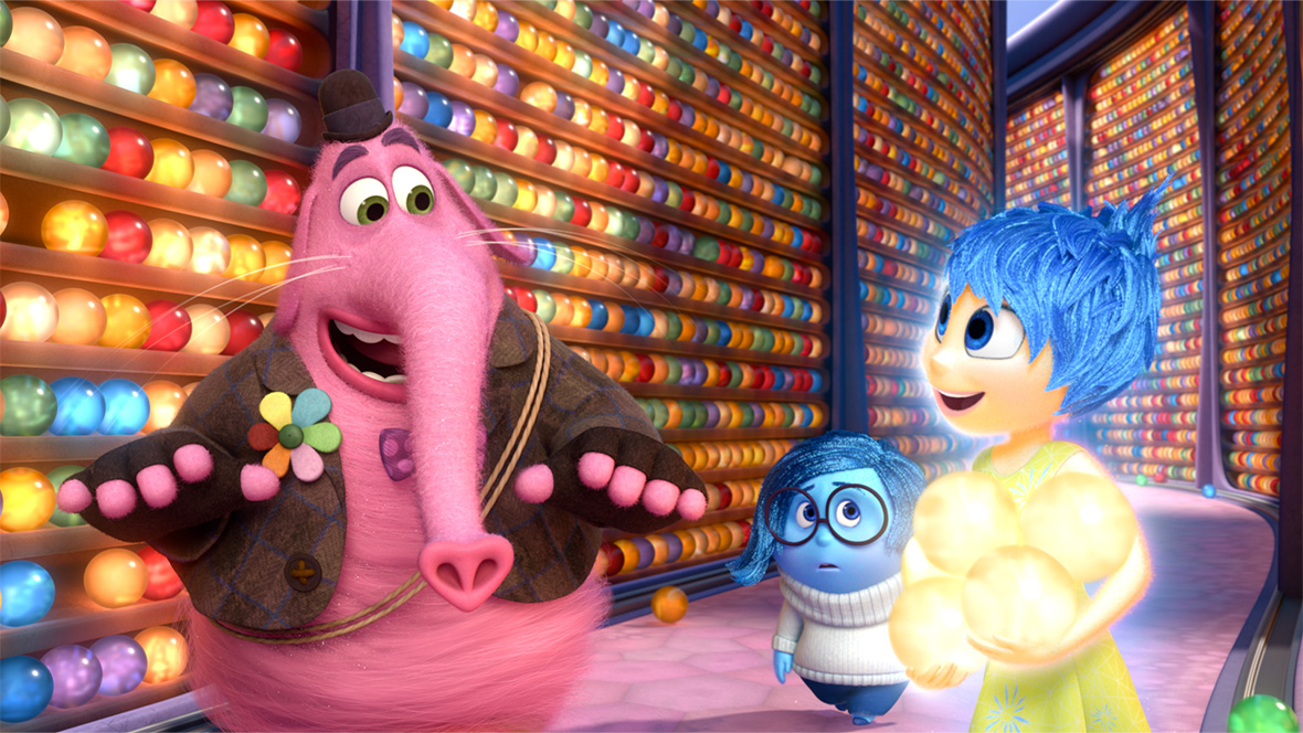 Bing Bong, Sadness, and Joy from Inside Out (2015) in front of Riley’s wall of memories.